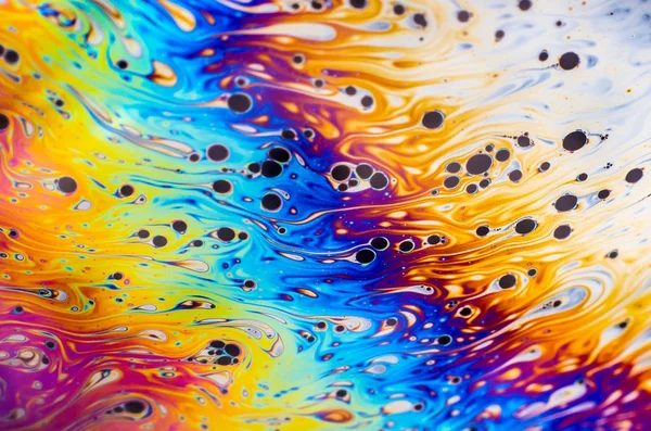 Beautiful psychedelic abstraction formed by light on the surface of a soap bubble