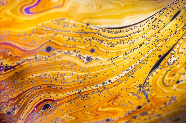 Beautiful psychedelic abstraction formed by light on the surface of a soap bubble