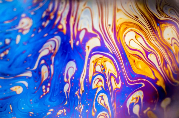 Beautiful psychedelic abstraction formed by light on the surface of a soap bubble