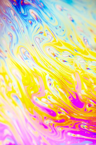 Beautiful psychedelic abstraction formed by light on the surface of a soap bubble