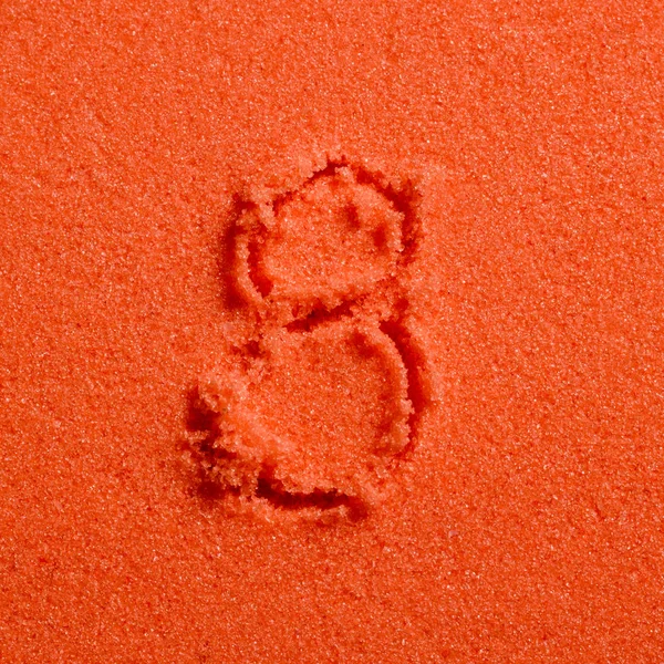 Numer 8 napisane na piasek pomarańczowy — Zdjęcie stockowe