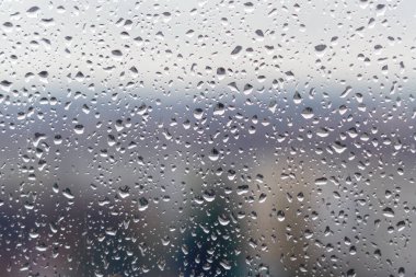 Pencere camında yağmur damlaları, arkaplan dokusu