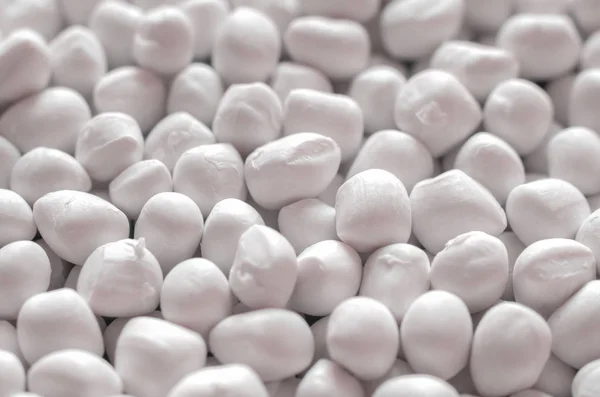 stock image White polymer dye in granules, background texture