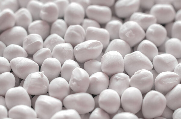 Белый полимерный краситель в гранулах, текстура фона