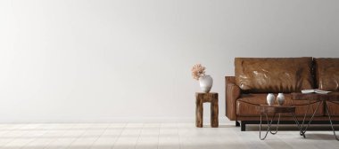 Duvar, Scandi-boho 'nun iç dekorasyonu ile eskimiş kahverengi deri mobilyalarla süslenir.