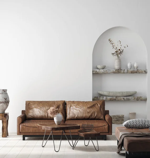 Duvar, Scandi-boho 'nun iç dekorasyonu ile eskimiş kahverengi deri mobilyalarla süslenir.
