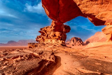 View through a rock arch in the desert of Wadi Rum, Jordan, Middle East  clipart