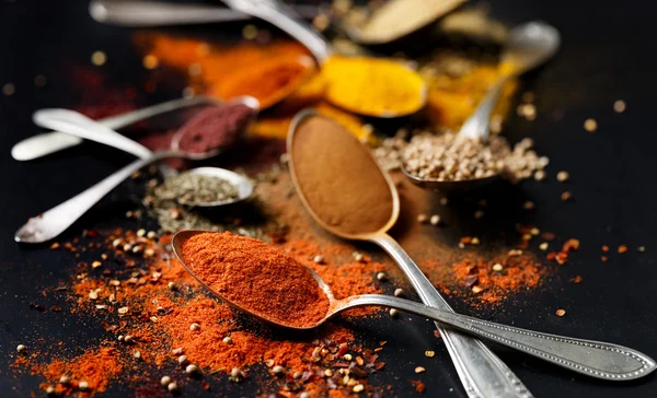 Spices and herbs on black background — Stock Photo, Image