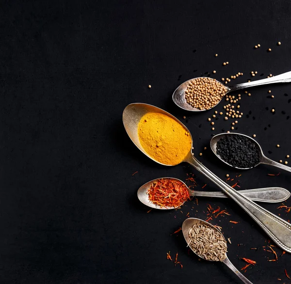Spices on black background — Stock Photo, Image