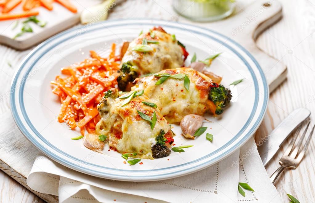 Roasted chicken thighs  stuffed with vegetables, baked with mozzarella cheese 