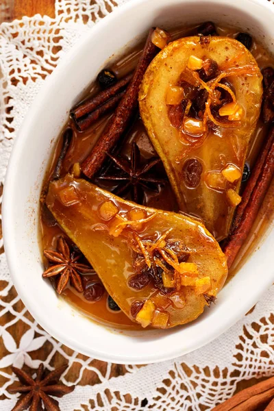 Baked pears with cinnamon and honey stuffed with raisins and candied orange peel Stock Image