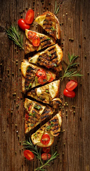 Sandwich with smoked sheep cheese, grilled zucchini, tomatoes and herbs on a wooden rustic table — Stock Photo, Image