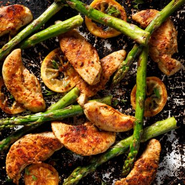 Grilled green asparagus with chicken breast and lemon clipart
