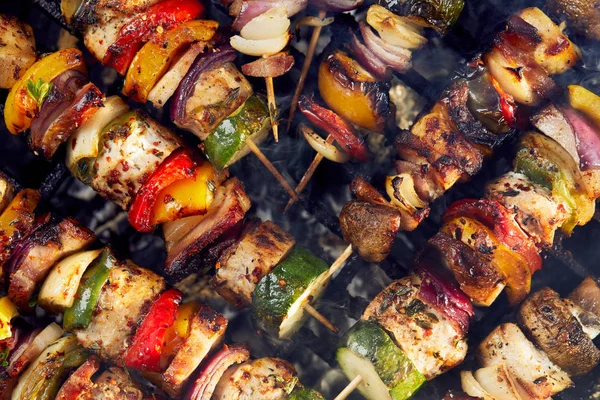 Grilled skewers on a grill plate, outdoor — Stock Photo, Image