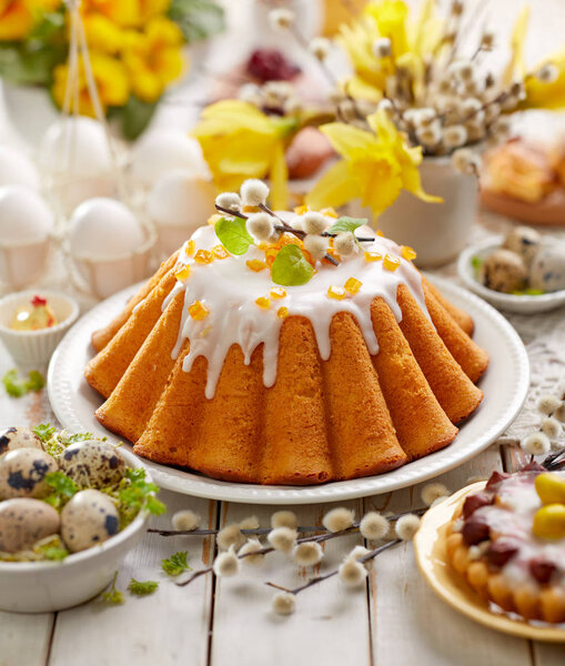 Easter yeast cake with icing and candied orange peel, delicious Easter dessert, traditional Easter pastries in Poland