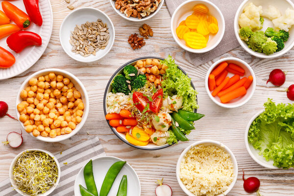 Buddha bowl, healthy and balanced vegan meal, fresh salad with a variety of vegetables, healthy eating concept. Top view