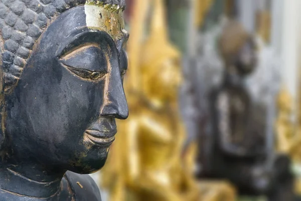 Buddha face on blurry background
