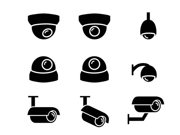 Iconos de cámara CCTV y símbolo en silueta, vector — Vector de stock