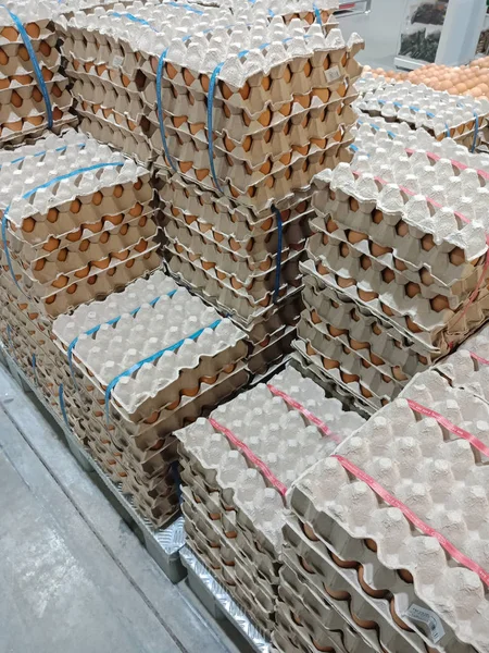 Group of Chicken Eggs in gray paper tray for sale