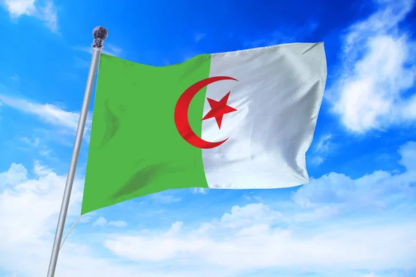 Flag of Algeria developing against a clear blue sky — Stock Photo, Image