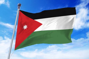 Masmavi bir gökyüzü karşı gelişen Jordan bayrağı