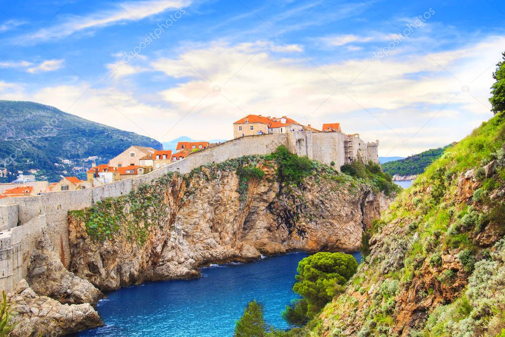 Beautiful view of the fortress wall and the gulf of the historic city of Dubrovnik, Croatia on a sunny day.