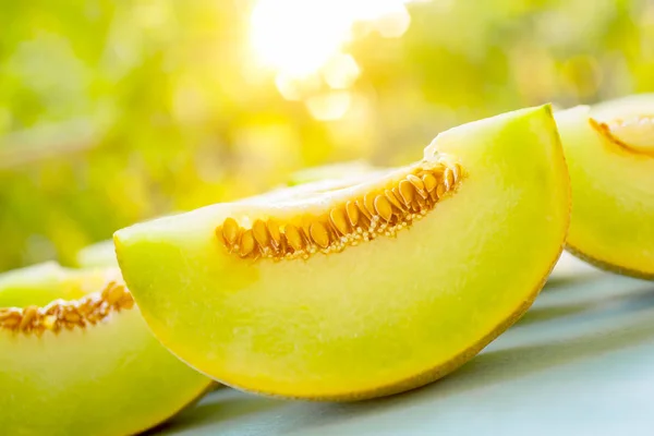 Fresh sweet green melon on the wooden table