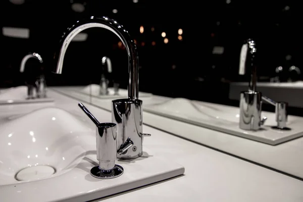 Chrome faucet with washbasin and modern black bathroom — Stock Photo, Image