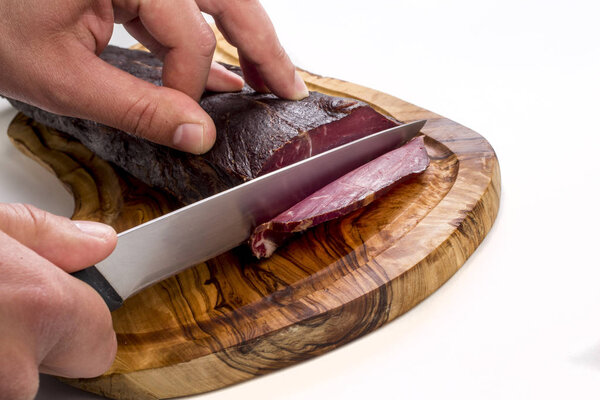 smoked ham on a wooden board