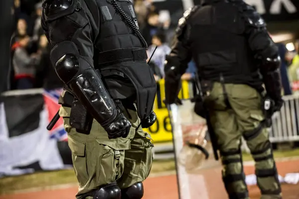 Special police unit at the stadium event secure a safe match against the hooligans