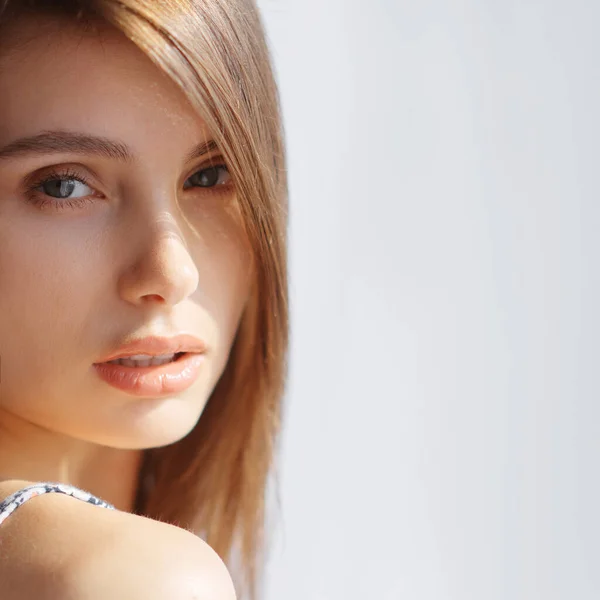 Portrait of a sexy girl by the window looking at the camera — Stock Photo, Image