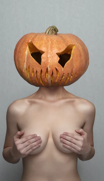 Sexy Woman with Halloween Pumpkin Head