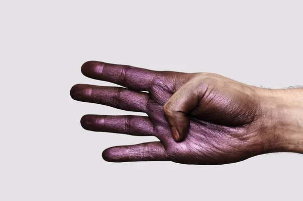 Mano púrpura mostrando cuatro dedos —  Fotos de Stock