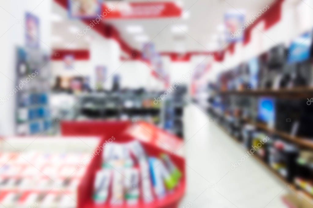 A blurred abstract background can be an illustration to an article about shopping malls and the sale of digital technology