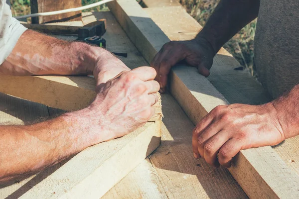 the hands of the workers carpenters