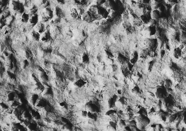 the porous texture of the stone flagstones limestone, black and white photo