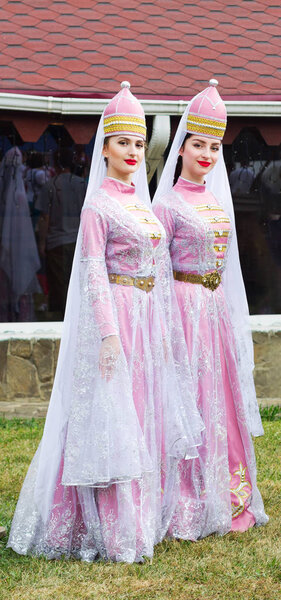  young girls Circassian in Adyghe traditional costumes at the festival of cheese Adyghe in Adygea