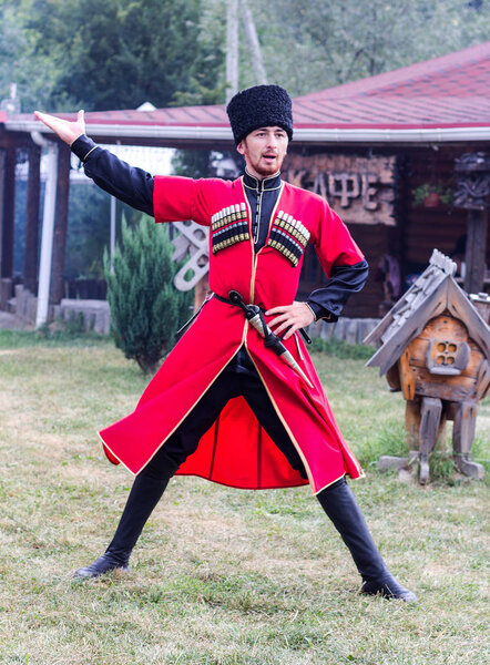 the guy Adyg dancing traditional dance Circassian at the festival of cheese Adyghe in Adygea