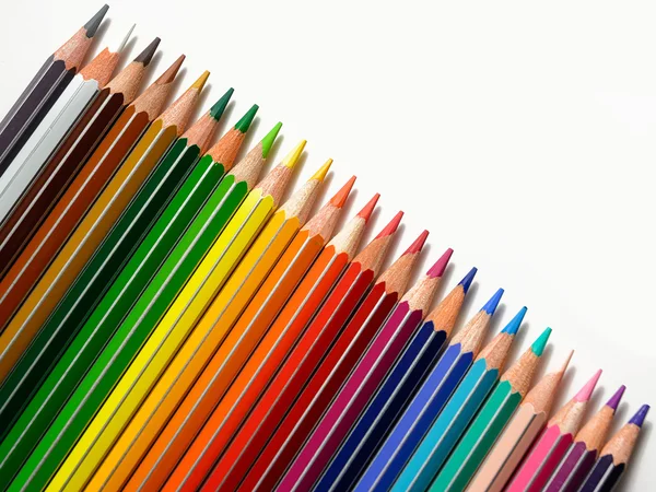 Colored pencils in a row — Stock Photo, Image