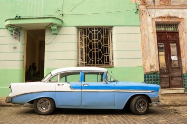 Old American car parked on the cuban street clipart