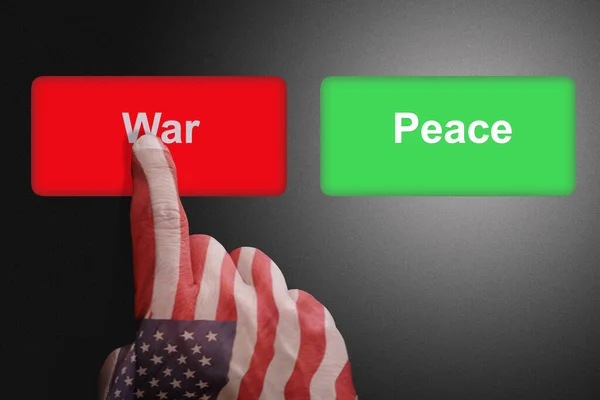 Hand with the colors of the American flag chooses the war button — Stock Photo, Image