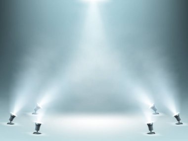 Sahne, spot ışıklarıyla aydınlatılıyor.