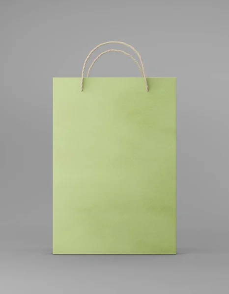 Eco embalaje mockup bolsa de papel kraft con asa frontal. Plantilla verde medio estándar sobre fondo gris publicidad promocional. Renderizado 3D — Foto de Stock