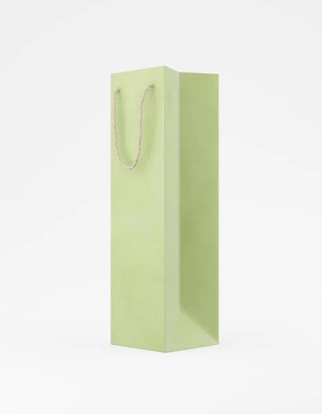 Eco packaging mockup bag kraft paper with handle half side. Tall narrow green template on white background promotional advertising. 3D rendering — Stock Photo, Image