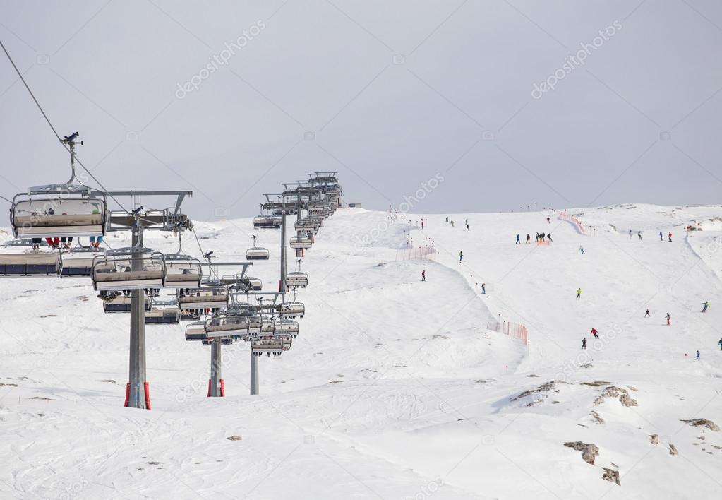 Ski lifts in ski resort going up and down 
