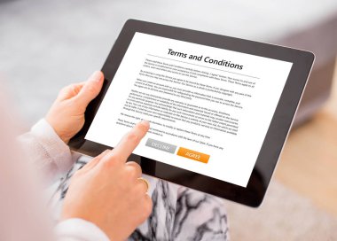 Person accepting terms and conditions on tablet clipart