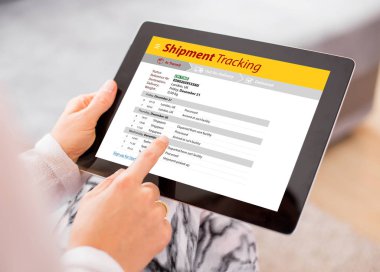 Person tracking shipment on tablet clipart