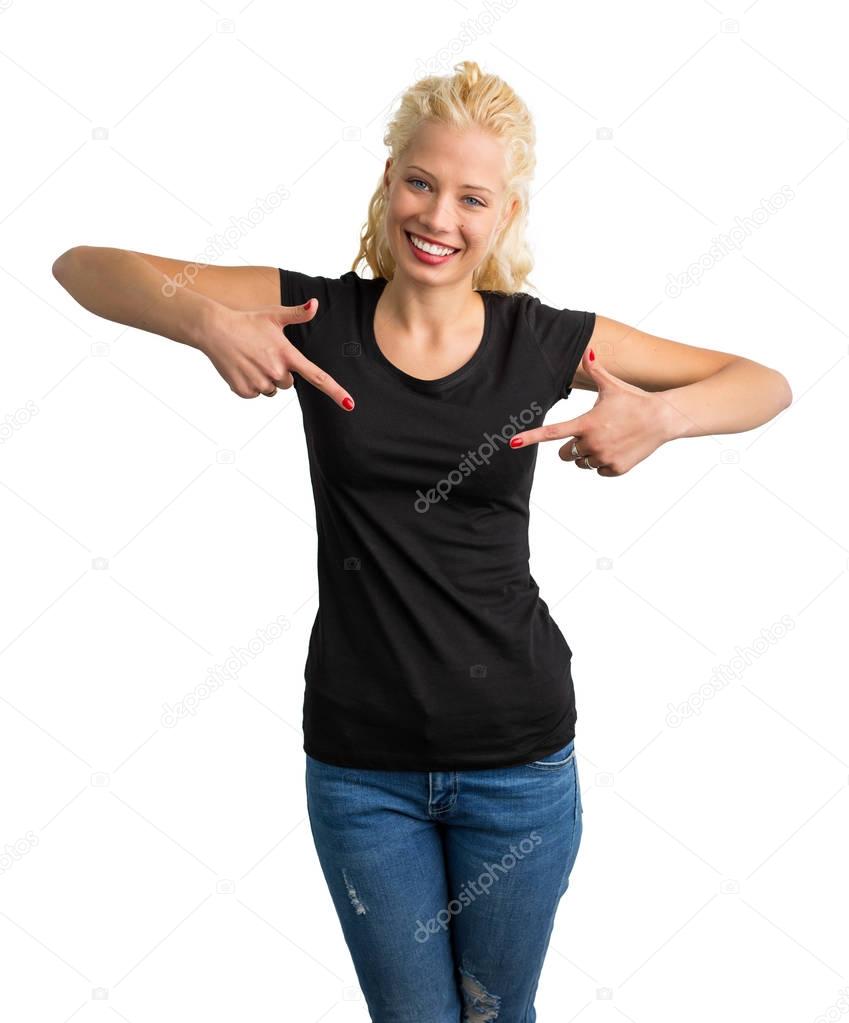 Woman in black round neck T-shirt pointing at it with both hands