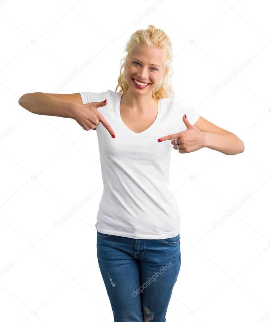 Woman in white V-neck T-shirt pointing at it with both hands