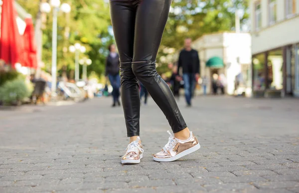 Woman in modern street shoes standing in the city — Stock Photo, Image